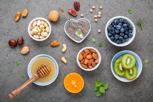 Ingredients for healthy foods background. Concept of healthy food on dark stone background.