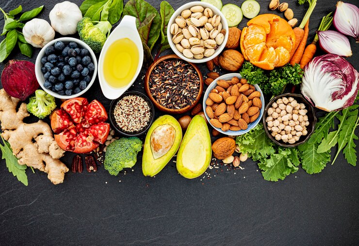 Photo ingredients for the healthy foods selection. the concept of healthy food set up on dark stone background.