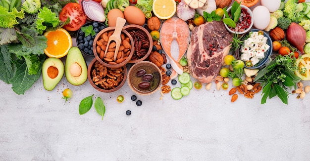 Ingredients for healthy foods selection set up on white concrete background