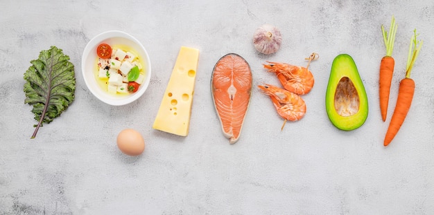 Ingredients for healthy foods selection set up on white concrete background