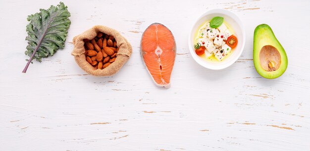 Ingredients for healthy foods selection set up on white wooden background