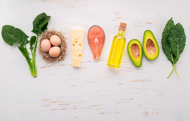 Ingredients for healthy foods selection set up on white wooden background