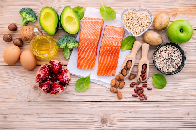 Ingredients for the healthy foods selection set up on wooden background.