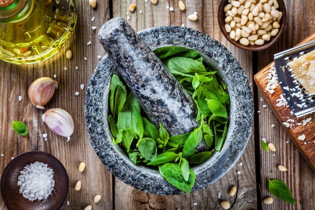 Ingredients for homemade pesto basil parmesan pine nuts garlic olive oil and salt