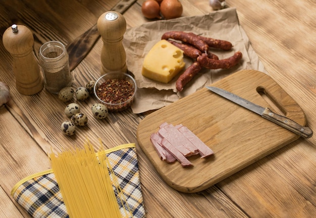 Ingredients for Italian pasta Raw spaghetti ham spices