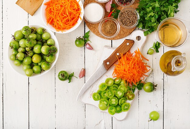 Ingredients for Korean salad from green tomatoes and carrots