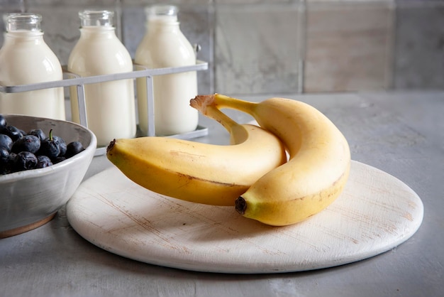 Ingredients for making banana smoothie healthy food Closeup selective focus