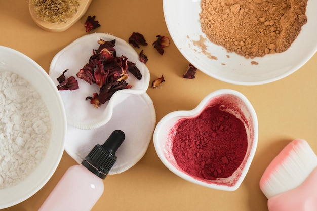 Ingredients for making natural face powder dry hibiscus petal powder turmeric starch