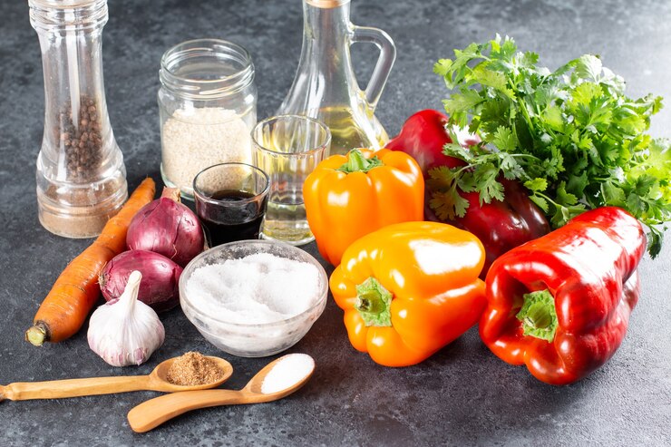 Photo ingredients for making a spicy salad with bell peppers, carrots, vegetables and sesame seeds. step by step recipe. healthy food