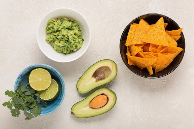 Ingredients Mexican guacamole sauce on a light table