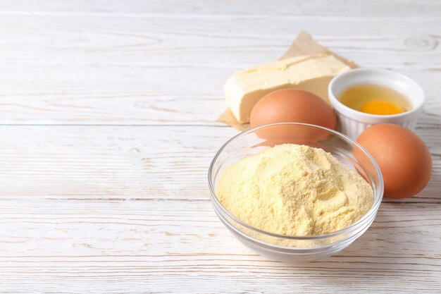 Ingredients for pie or cake cooking on wooden table