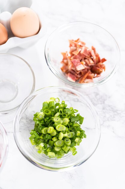 Ingredients to prepare bacon and cheese egg muffin