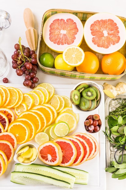 Ingredients for preparing detox citrus infused water as a refreshing summer drink.