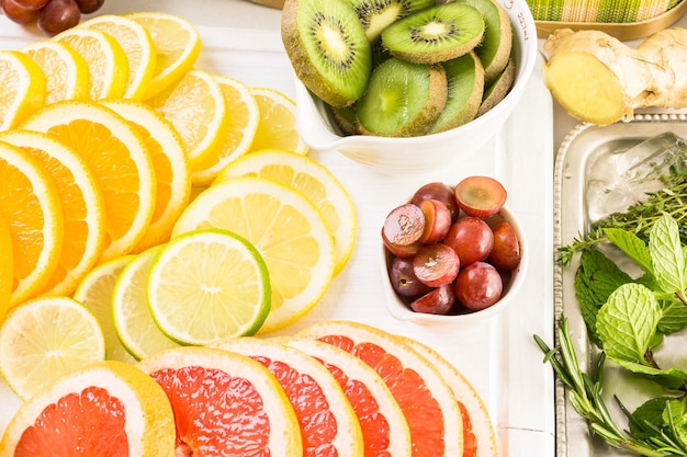 Ingredients for preparing detox citrus infused water as a refreshing summer drink