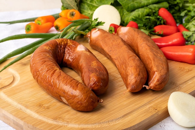 ingredients for preparing a recipe sausage parsley on a table