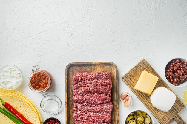 Ingredients for quesadilla with chicken tortilla corn chicken onion tomatoes and pepper cheese on white background top view flat lay with copy space for text