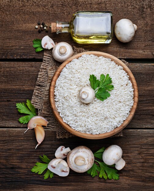 Ingredients for risotto: rice, mushroom, garlic, oil