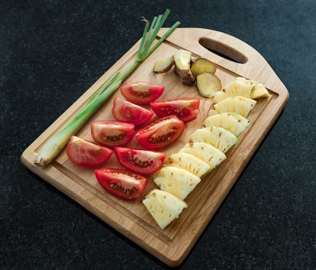 Ingredients set for sweet and sour sauce. Tomatoes, pineapple, lemongrass and ginger