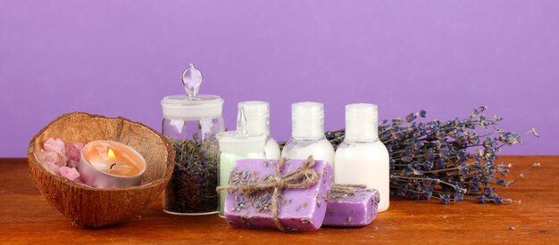 Ingredients for soap making on violet background