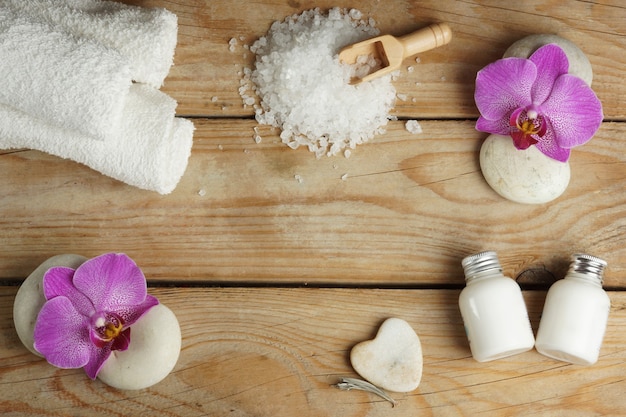 Ingredients for spa procedures are white on a wooden table