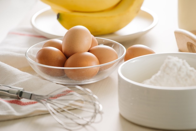 Ingredients and tools to make a cake, flour, butter, sugar,eggs