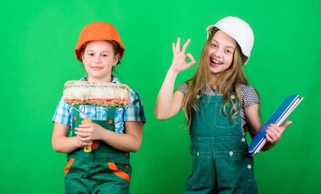 Initiative children provide renovation their room green background Amateur renovation Dreaming about new playroom Home improvement activities Future profession Kids girls planning renovation