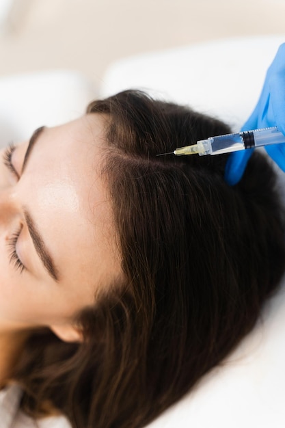Injection hair follicles with special cosmetology syringe Mesotherapy process