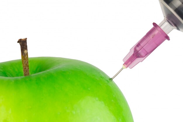 Injection needle apple green isolated on white wall