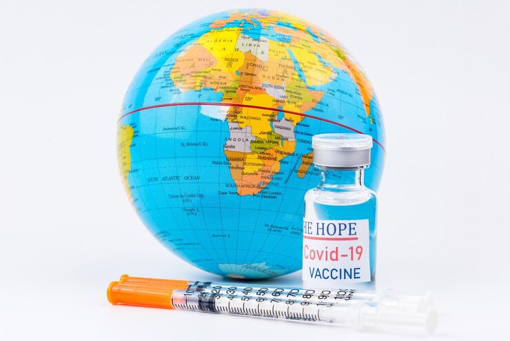 Photo injection syringe needle globe model  close up vaccine medical concept covid-19concept