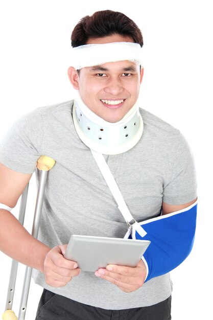 Injured young man using gadget