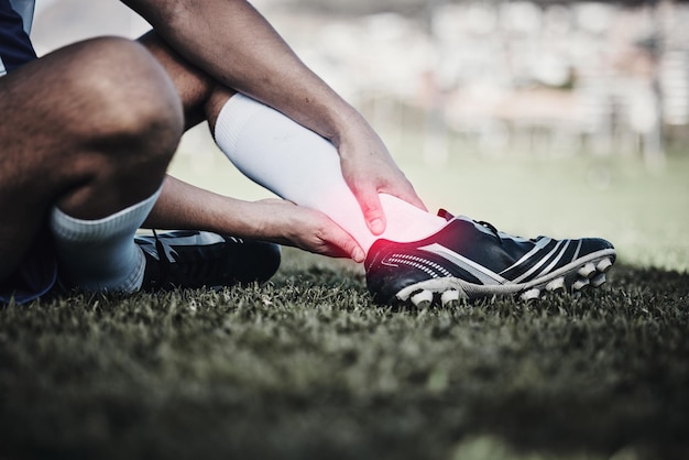 Photo injury soccer and a man on a field with foot pain training accident and medical emergency at a game inflammation football and a male athlete with a leg or anatomy problem during sport on grass