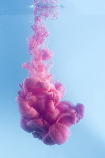 Ink flowing in water closeup