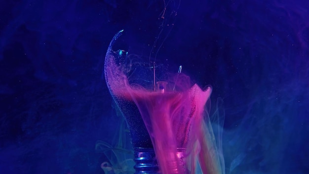 Ink water drop broken light bulb pink blue smoke