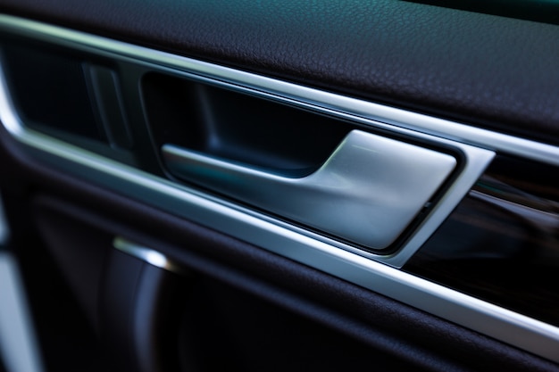 Inner door handle, modern car interior detail