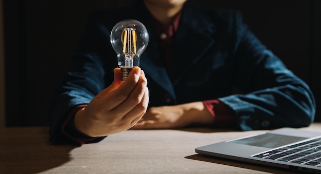 Innovation hands holding light bulb for concept new idea\
concept with innovation and inspiration innovative technology in\
science and communication concept