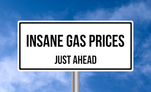 Photo insane gas prices just ahead road sign on sky background