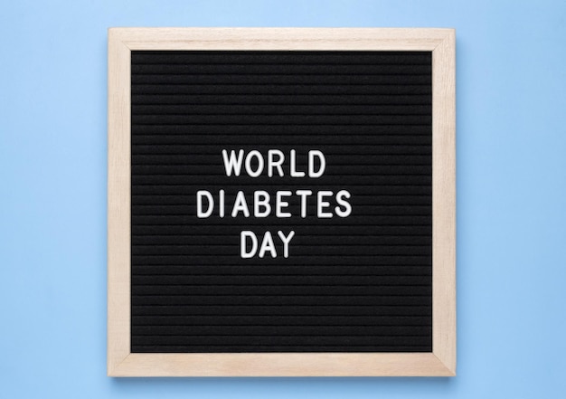 Inscriptie wereld diabetes dag op een blauwe achtergrond Wereld diabetes dag 14 november Kopieer ruimte Bovenaanzicht