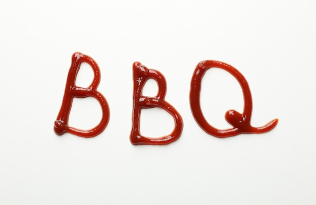 Inscription BBQ made of sauce on white