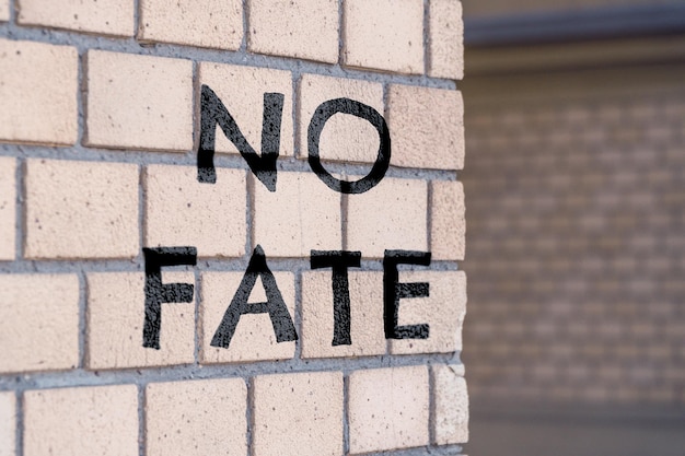 The inscription on the bricks no fate The inscription on the wall of the building