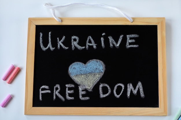 The inscription in chalk on the blackboard Ukraine and freedom and the heart