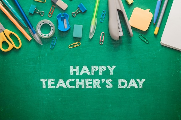 Inscription in chalk on a green school board happy teachers day flat lay the concept of the professi