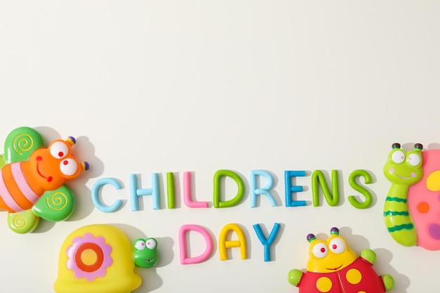 the inscription childrens day with toy insects