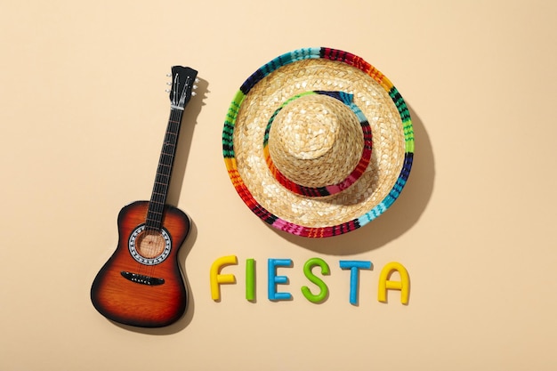 The inscription fiesta with a sombrero on a light background