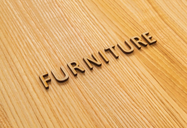 Photo the inscription furniture on the oak table top. background