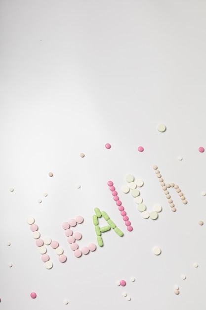 The inscription "Health" from multi-colored tablets