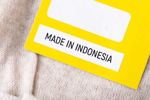 Photo inscription made in indonesia on linen clothes close up production export and import of textile products world global trade