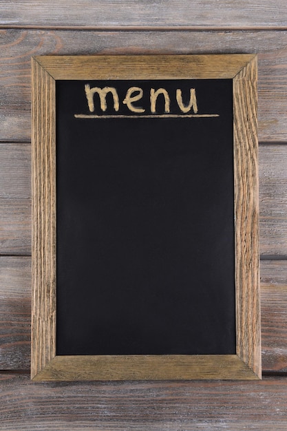 inscription menu on chalkboard on table closeup