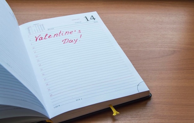 The inscription in the open diary Valentine's Day