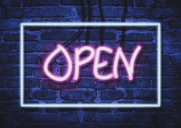 Photo inscription open in pink neon letters rectangular glowing blue neon frame on brick wall background