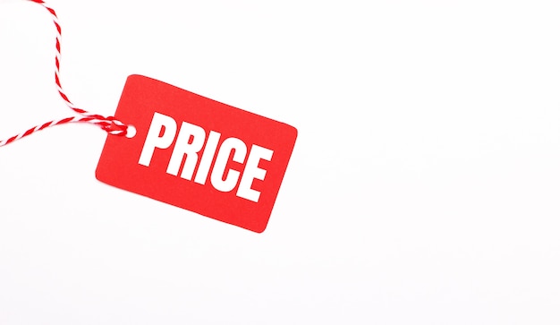 Premium Photo | The inscription price on a red price tag on a light  background. advertising concept. copy space